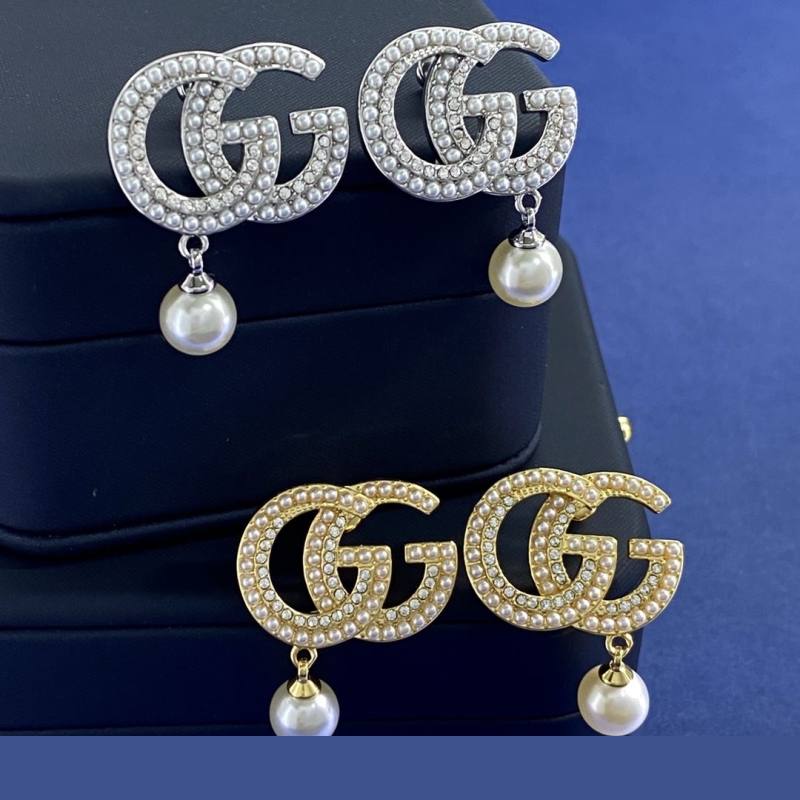G*u*i earrings